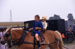 Amish children on horse by Dennis L. Hughes