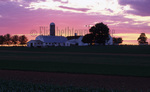 Amish farm at sunrise or sunset by Dennis L. Hughes