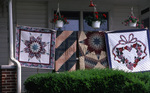 Quilts on clothesline by Dennis L. Hughes