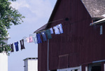 Amish clothesline in front of barn by Dennis L. Hughes