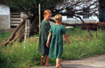Two Amish girls walking by Dennis L. Hughes