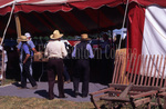 Amish men walking into tent by Dennis L. Hughes