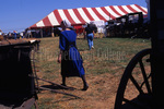 Amish woman at mud sale by Dennis L. Hughes