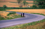 Two Amish boys walk with wagon by Dennis L. Hughes