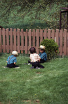 Amish boys sitting by Dennis L. Hughes