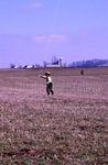 Amish boy flying kite by Dennis L. Hughes