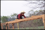 Amish boy on playground by Dennis L. Hughes