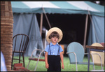 Amish boy at market by Dennis L. Hughes