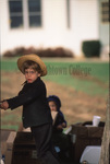 Amish boy looking towards camera by Dennis L. Hughes