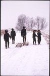 Amish children walk in snow by Dennis L. Hughes
