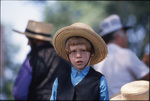 Amish boy looking into camera by Dennis L. Hughes