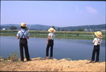 Three boys cast fishing rods by Dennis L. Hughes