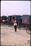 Boy in parking lot by Dennis L. Hughes